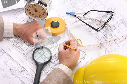 Image of Businessman with architectural plans 