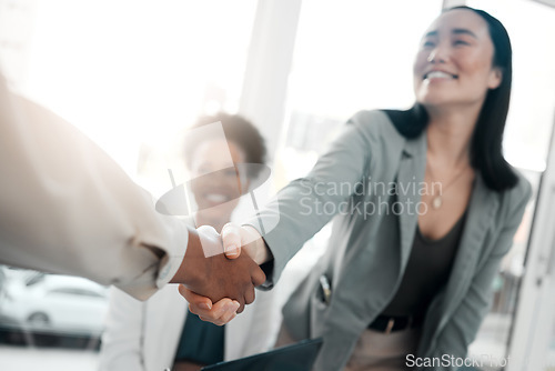 Image of Healthcare, onboarding and handshake, doctors at job interview, meeting with HR recruitment agent. Diversity, human resources and hiring, asian woman shaking hands with doctor in welcome or thank you