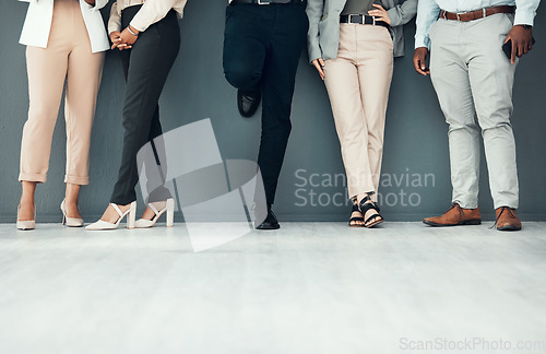 Image of Legs, waiting room and group of people for interview, recruitment or job opportunity on wall background. Shoes, candidates and men with women on mockup for work hiring, process and company startup