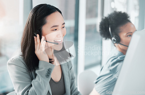 Image of Call center, consulting and asian woman at computer in office for customer service, telemarketing and help desk. Happy, smile and contact us with consultant for technical support, advisory and sales