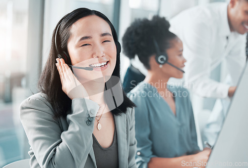 Image of Call center, smile and portrait of asian woman at computer for customer service, telemarketing and help desk. Happy, solution and contact us with consultant for technical support, advisory and sales