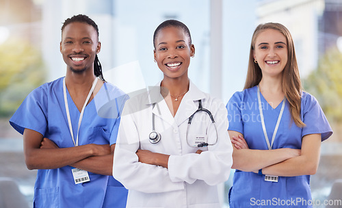 Image of Doctors team, arms crossed and portrait at hospital with teamwork, diversity and solidarity for healthcare. Nurse, black man and women leader for student internship, and collaboration for wellness