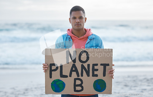 Image of Save earth, sign and man protest at beach pollution, environment and green, eco planet. Ocean, sea and portrait of person with nature globe poster for awareness, global warming and climate change