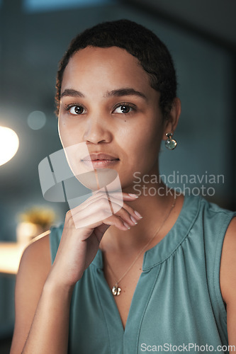 Image of Administrator, serious and portrait of a businesswoman with focus and employee late at night or evening in an office. Confident, black woman and corporate face at startup company or small business