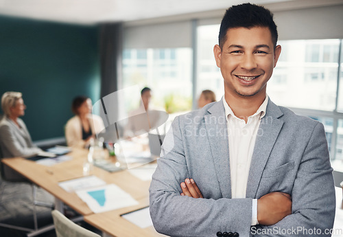 Image of Leadership, portrait and businessman with crossed arms in the office in meeting with colleagues. Corporate, management and professional male manager standing with confidence in boardroom in workplace