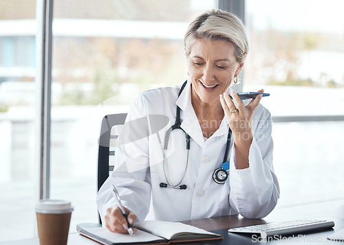 Image of Woman, doctor and speaker phone, call and schedule appointment with health, writing notes and confirm consultation. Communication, tech and healthcare, calendar and senior medical employee at clinic