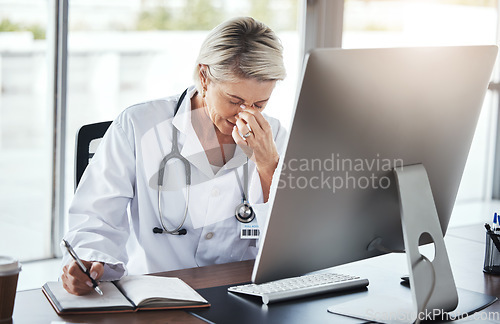 Image of Healthcare, doctor and woman with headache, stress and depression in office, burnout and overworked. Female employee, consultant tired or senior medical professional in workplace, computer or anxiety