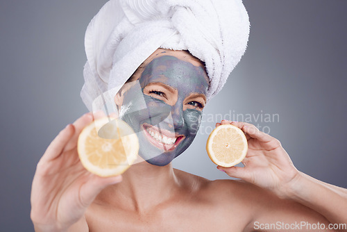 Image of Lemon mask, clay and woman with smile for healthy facial, beauty portrait and wellness makeup in studio. Happy female model, citrus fruits and vitamin c for charcoal product, shower and laughing face