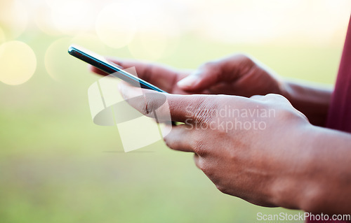 Image of Hands, phone and communication on mockup for social media, texting or chatting in the outdoors. Hand of person typing on smartphone with 5G connection, browsing or mobile app on blurred background