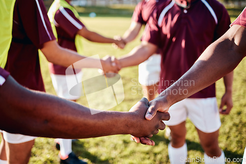 Image of Man, sports and handshake for team introduction, greeting or sportsmanship on the grass field outdoors. Sport men shaking hands before match or game for competition, training or workout exercise