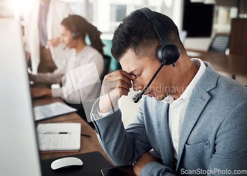 Image of Customer support consulting, burnout headache and man telemarketing on contact us CRM or telecom microphone. Call center depression, ecommerce or information technology consultant with medical crisis