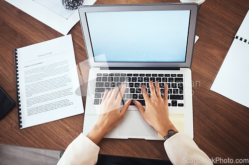 Image of Laptop, mockup and hands of woman typing business report, proposal or feedback on paper from above. Freelance writer or journalist writing web article with internet research and documents in office.