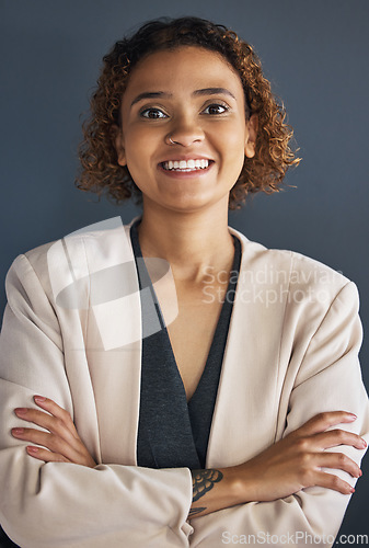 Image of Business woman, face and arms crossed in portrait, happy with success and vision on studio background. Professional mindset, Mexican employee and growth, career goals with leadership in Mexico office