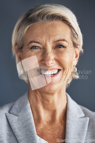 Image of Pride, corporate and professional portrait of woman isolated on a grey studio background. Business, success and face of a mature, confident and executive ceo of a company with experience on backdrop