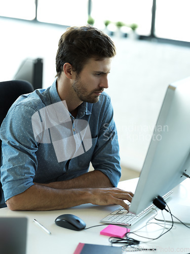 Image of Concentrating, computer and typing with business man in office for web design, analytics and planning. Vision, technology and internet with employee in digital agency for idea, advertising and email