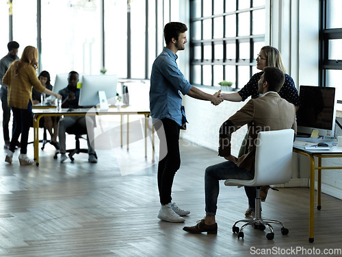 Image of Greeting, meeting and business people handshake in an office or workplace as agreement on partnership. Team, teamwork and startup colleagues collaborate and welcome a deal or employee to strategy