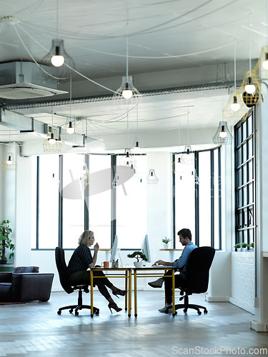 Image of Office, corporate and colleagues on computer for report, review or online project at desk in coworking space. Employee, team and business people at startup for proposal, planning and creative design