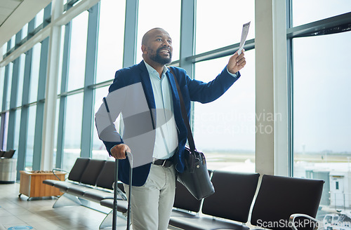 Image of Black man, ticket and airport walking to departure for travel, business trip or journey by windows. Happy African American male with smile holding document or boarding pass ready for airplane flight