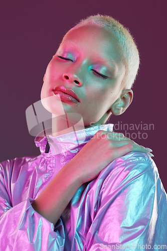 Image of Holographic fashion, woman face and makeup glow for hologram trend isolated in studio. Futuristic, vaporwave and art color jacket on cyberpunk aesthetic model person for retro cosmetics shine on skin