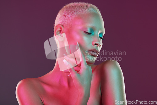 Image of Neon, skincare and beauty, woman with hand in face, makeup and light in creative advertising on studio background. Cyberpunk, art girl and fantasy model isolated in futuristic skin care mockup space