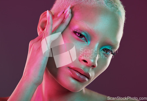 Image of Skincare, beauty and cyberpunk, portrait of woman with neon makeup and lights for creative advertising on studio background. Art girl, cosmetics and model isolated for futuristic face mockup