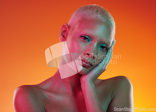 Image of Art, neon beauty and portrait of woman with makeup and light in creative advertising on orange background. Cyberpunk, unique face and model isolated for skincare and futuristic mockup in studio