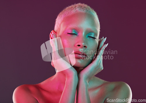 Image of Skincare, beauty and eyes closed, woman with neon makeup and lights for creative advertising on studio background. Cyberpunk, product placement and model isolated for skin care and futuristic mockup.