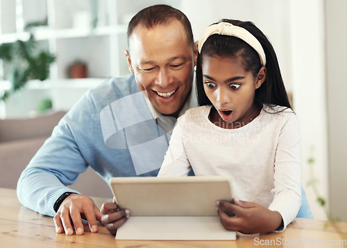 Image of Digital tablet, shock and girl with her father streaming a movie or video online for entertainment. Surprise, technology and child watching a film or show with her dad on mobile device at their home.