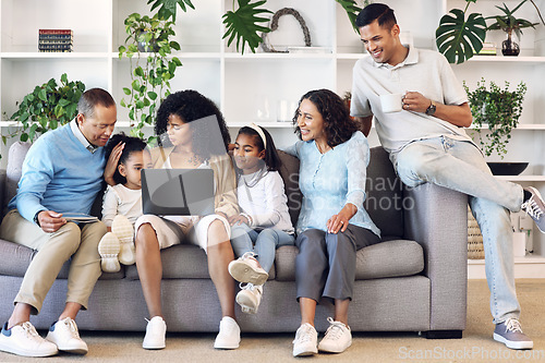 Image of Big family, home and laptop on couch learning with online education, games or movie. Parents, grandparents and children relax together in lounge with internet for quality time streaming and bonding