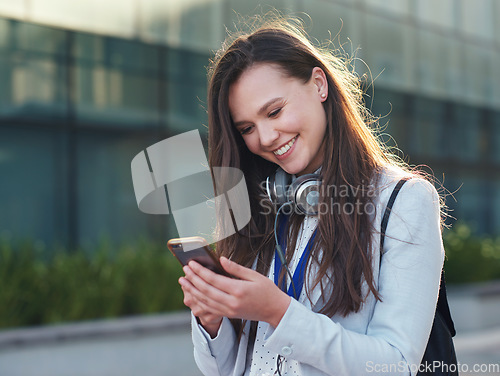 Image of Business woman, phone and smile for communication, social media or texting and chatting in city. Happy female typing and smiling on smartphone for 5G connection, mobile app or browsing in networking