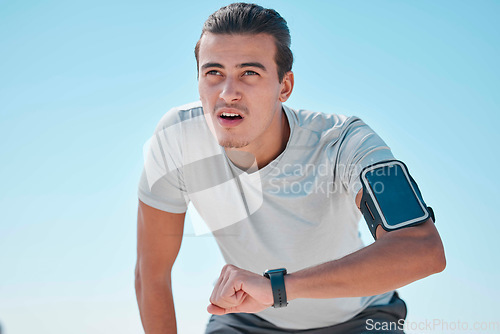Image of Smart watch, outdoor fitness and man tired from exercise workout, training and run. Stopwatch time, sports person and breathing for heart rate, healthy body progress and monitor wellness on data app
