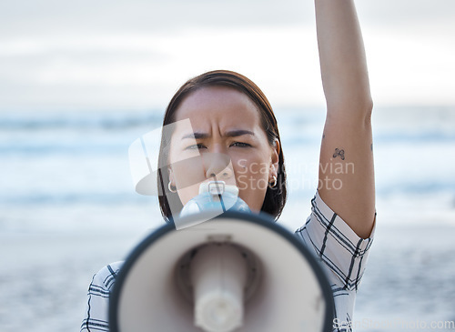 Image of Megaphone, climate change protest and Asian woman at beach protesting for environment, global warming and to ocean stop pollution. Save the earth, activism and angry female shouting on bullhorn.