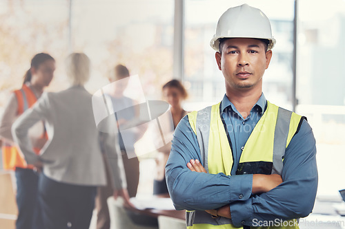 Image of Portrait, construction worker and leadership with a man engineer standing arms folded in an architecture office. Industrial, manager and building with a male architect working on a design project