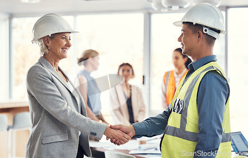 Image of Collaboration, happy and engineering with handshake of people in office for architecture, b2b or contract. Partnership, meeting and shaking hands with employee for designer, construction or agreement