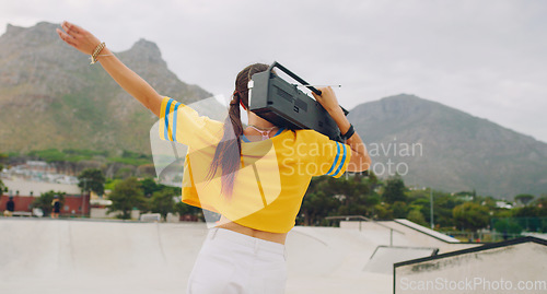 Image of Radio, dance and woman with a boombox in the city listening to music, moving and having fun. Freedom, hip hop and female dancing with energy to a song, album or playlist on a speaker in a urban town.