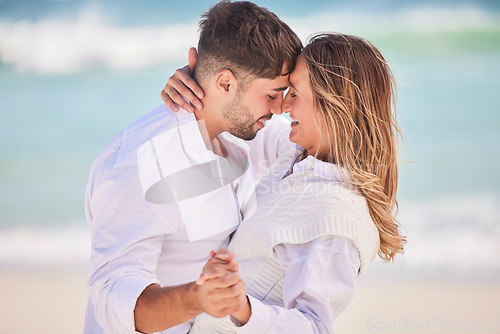 Image of Love, dance and happy with couple on beach for date, romance and anniversary celebration. Smile, bonding and affectionate with man and woman on holiday for hug, vacation and happiness together