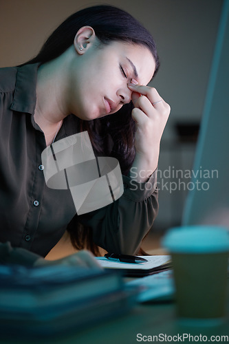 Image of Frustrated woman, working at night in office with computer and mental health of corporate business worker. Overworked person at desk, tired headache from late workload and employee burnout or stress