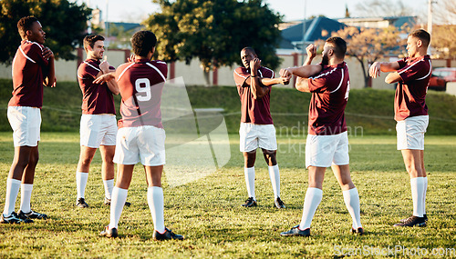 Image of Rugby, sports and warm up with a team getting ready for training or a competitive game on a field. Fitness, sport and stretching with a man athlete group in preparation of a match outdoor in summer