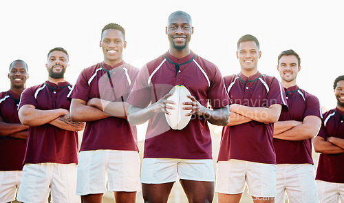 Image of Rugby, field and portrait of team with ball and smile standing together with confidence in winning game. Diversity, black man and group of strong sports men in leadership, fitness and happy teamwork.