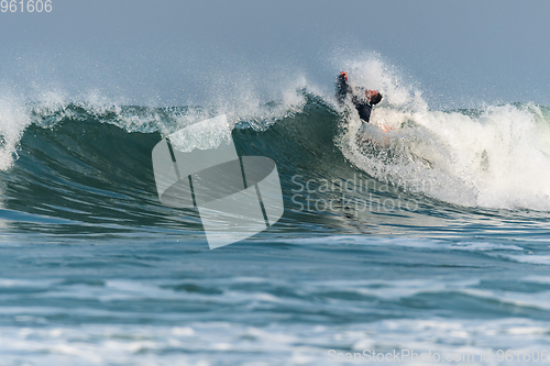Image of Bodyboarder surfing ocean wave