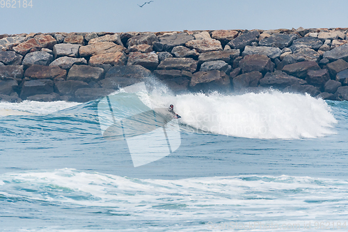 Image of Bodyboarder surfing ocean wave