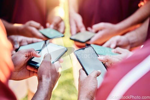 Image of Hands, phone and networking on mockup for sports collaboration, social media or team communication. Group of football players on smartphone for 5G connection, share or mobile app sync in circle