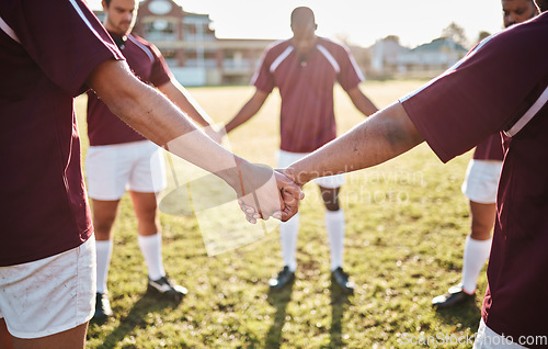 Image of Man, team and holding hands for sports huddle, collaboration or coordination on grass field. Group of men touching hand in circle for teamwork, community or sport solidarity for outdoor game or match