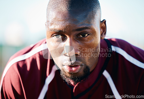 Image of Breathing, focus and black man in sports training, competition or game on rugby field and blue sky. Breathe, sweating and tired athlete or person thinking of workout, exercise or fitness strategy