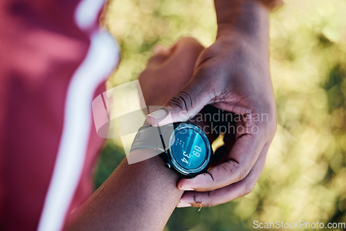 Image of Hands, smartwatch and fitness, heart rate check and sports, black man outdoor with health and technology. Workout, steps and digital, app and exercise with training, runner or athlete with progress