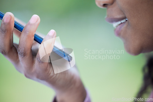 Image of Voice memo, black woman hand and face zoom outdoor on mobile connection and virtual note record. Online conversation and speaking of a young person listening to audio with a smile from communication