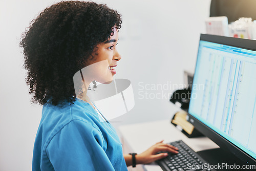 Image of Nurse, computer and black woman typing for research in healthcare reports or telehealth. Medical, health and happy female doctor with desktop for writing or online consultation in a hospital