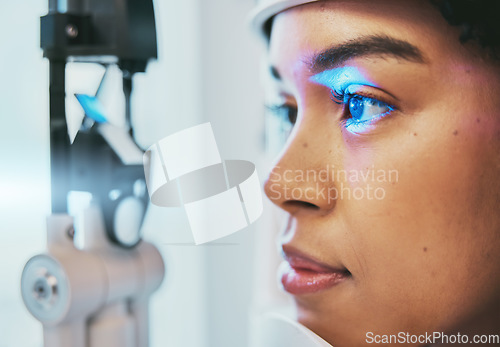 Image of Optometry, medical and eye exam with black woman and consulting for vision, healthcare and glaucoma check. Laser, light and innovation with face of patient and machine for scanning and ophthalmology