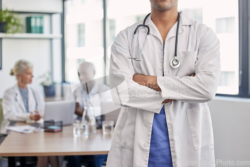 Image of Leadership, arms crossed and medical with hands of doctor for professional healthcare and surgery in clinic. Wellness, confidence and trust with leader man standing in hospital for expert consulting