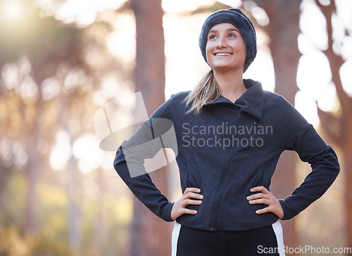 Image of Happy fitness, woman and thinking on hiking in park, forest and woods for exercise, training and workout. Female hiker smile with happiness, motivation and mindset for wellness goals, freedom or idea